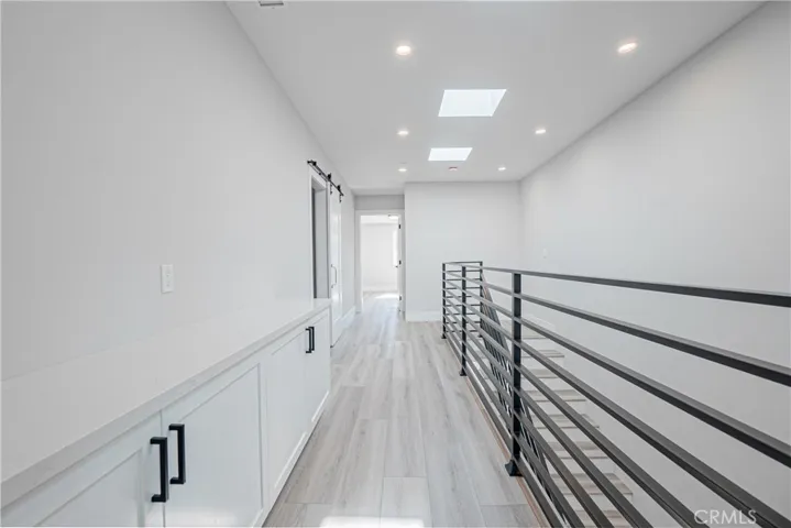3rd level storage cabinet and hallway to second, 3rd level en-suite.