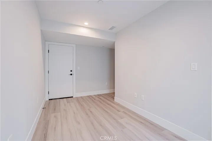 Ground level multi-use room. Door to garage.
