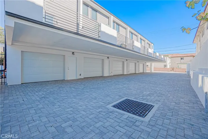 Rear driveway and tandem garage access.