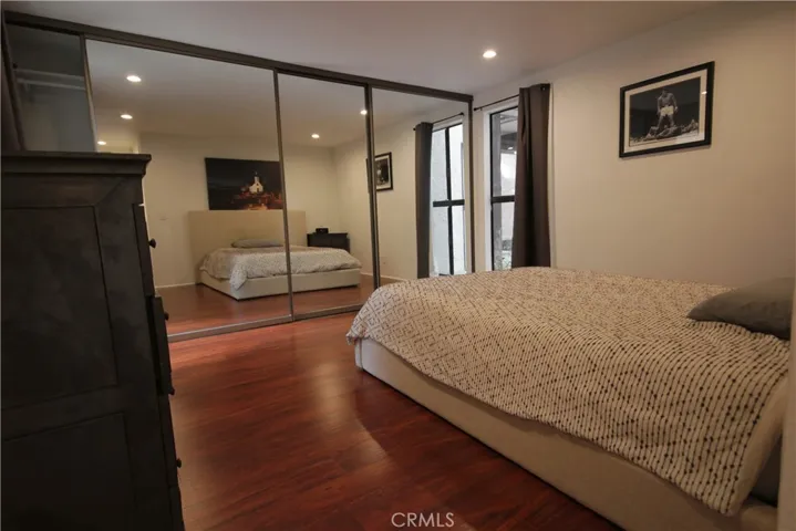 Master Bedroom with wall to wall closets with mirrored wardrobe doors!