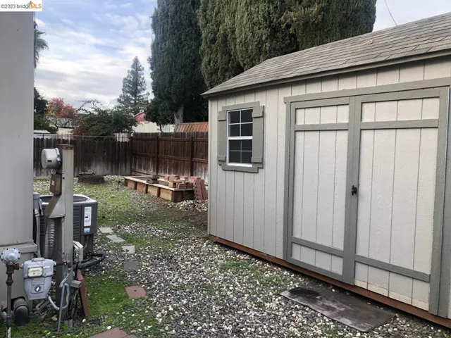 Large storage shed with double doors and overhead storage