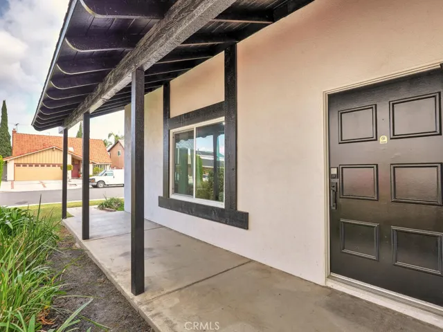 Front door hidden off the the side.