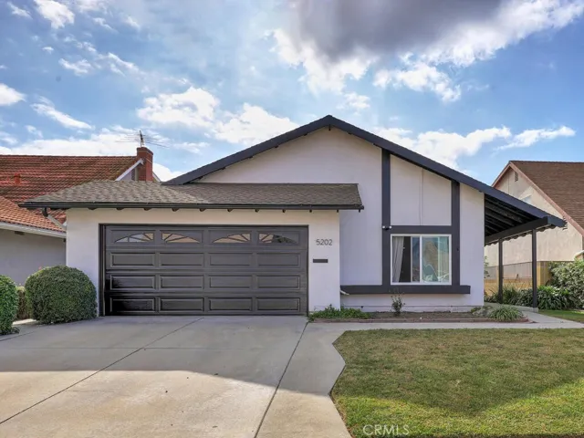 Exterior Front with two-car-garage and driveway.