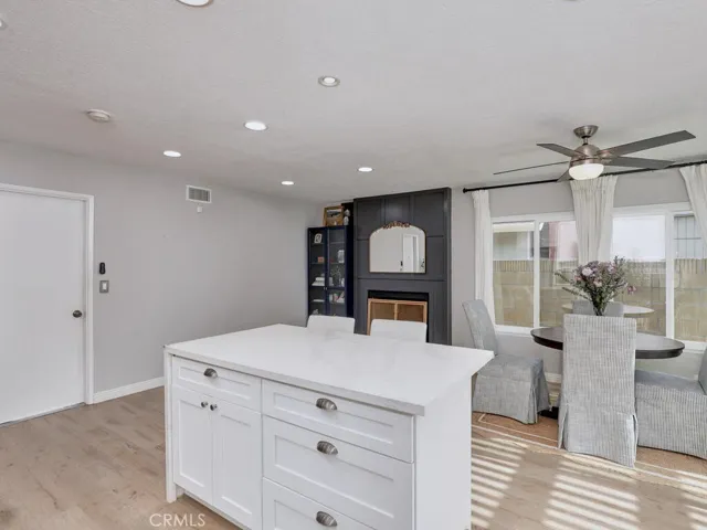Kitchen Island facing Dining and family room fireplace.