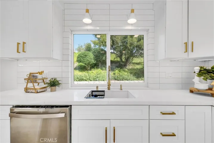 Modern appointments with gold hardware & fixtures