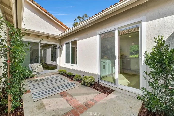 Sliding glass door to the kitchen and living room create bright and airy feel of outdoor living