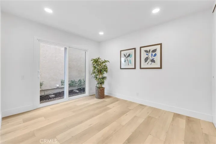 Secondary bedroom with slider to private side yard.