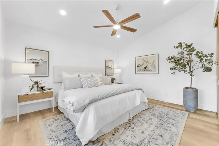 Generous primary suite with custom fan and lighting
