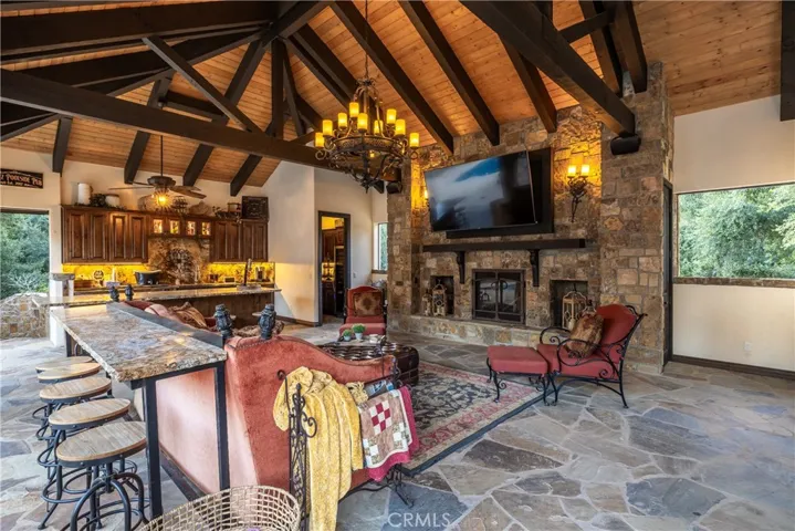 Cabana fireplace, stacked stone and a niche for storage.