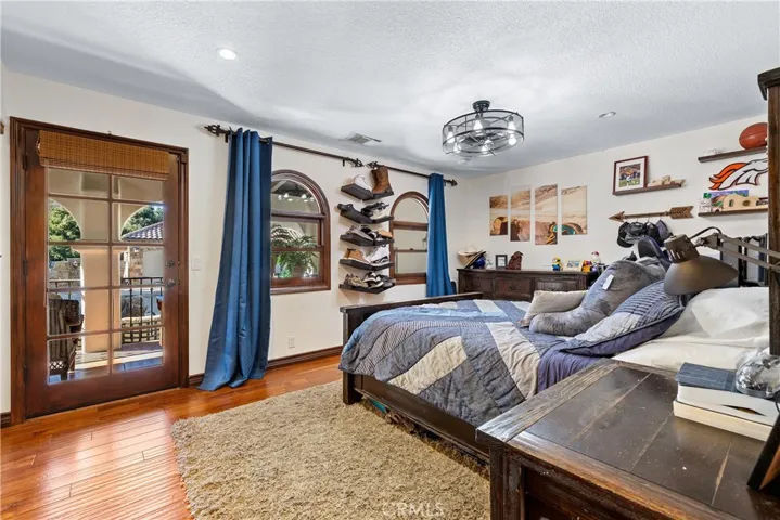 Second main floor bedroom with direct access to the backyard.