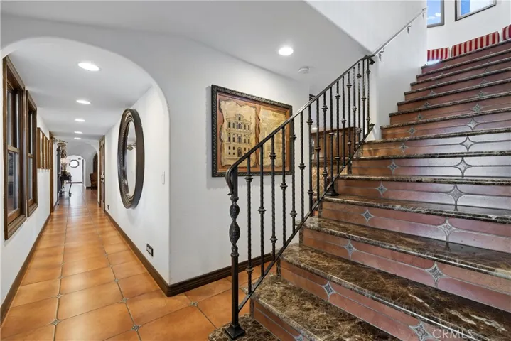 Staircase to two additional oversized bedrooms plus a loft.