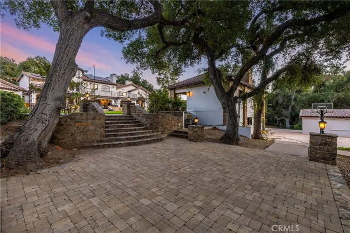 Backyard behind the pool and grass area.