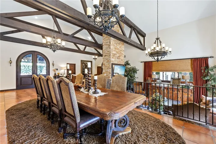 Formal dining room toward the front door and overlooking the formal living room.
