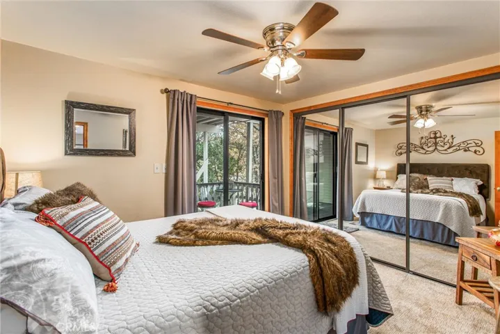 Suite bedroom has cedar closet and goes out to it's own deck and stairs to parking.