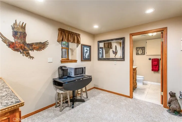 The "could be" kitchen area has plumbing in the wall to make it a complete kitchen if desired.