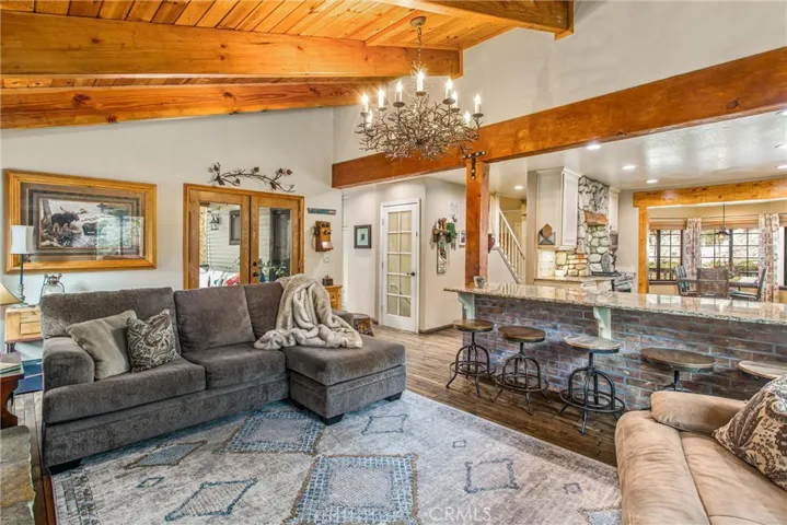 Eating bar convenient to kitchen and family room.  Love that mountain chandelier!