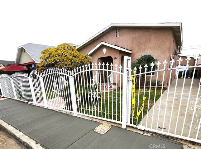 Wrought iron front and new concrete sidewalk.