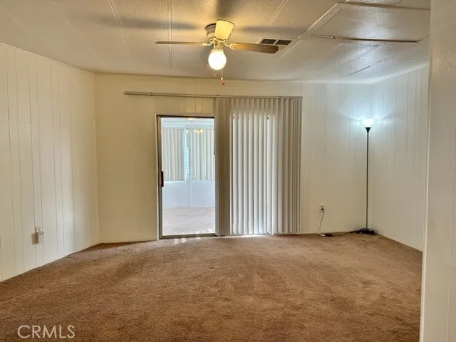 Dining area looking into sunroom.  Closed off with sliding​​‌​​​​‌​​‌‌​‌‌​​​‌‌​‌​‌​‌​​​‌​​ door