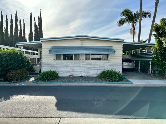 Another view of the front of the home with the covered space.  Enough for 2 cars.