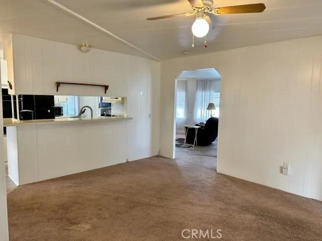 Dining room looking into living room & kitchen