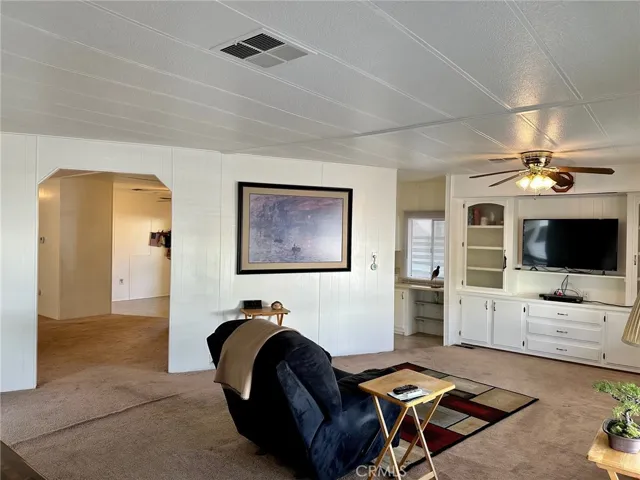 Living room flows into the dining area and kitchen