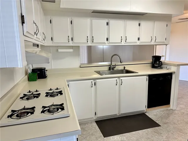 Open, bright kitchen with so much cabinet space