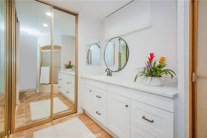 Master Bathroom with laminate flooring and quartz countertops