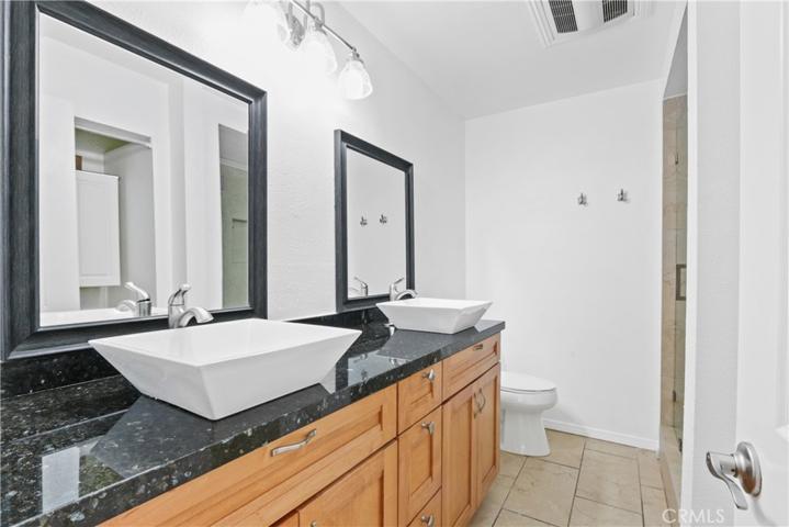 Master Bathroom - dual sinks, storage closet & walk in shower