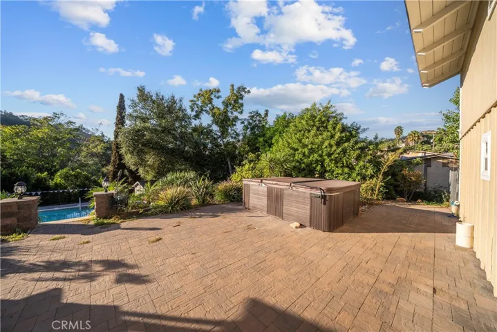 Paved patio and jacuzzi for 8