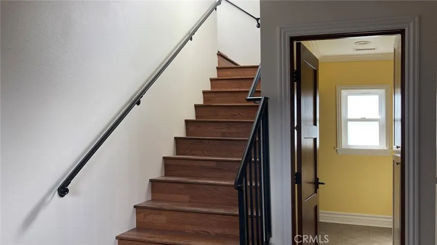 Mud room, bathroom and stairs to upper level