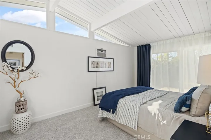 Master bedroom has access to the backyard.