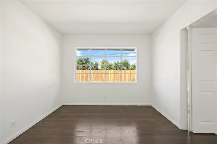 Another view of bedroom #1 with double doors opening to the living room.