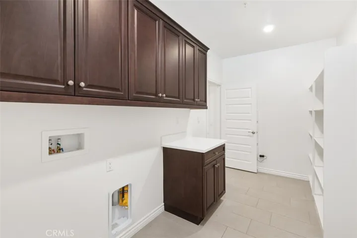 Laundry Room with storage cabinets & Shelving