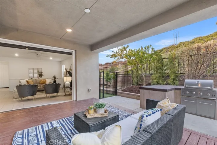 View from Patio into Living Room with Accordion doors fully opened