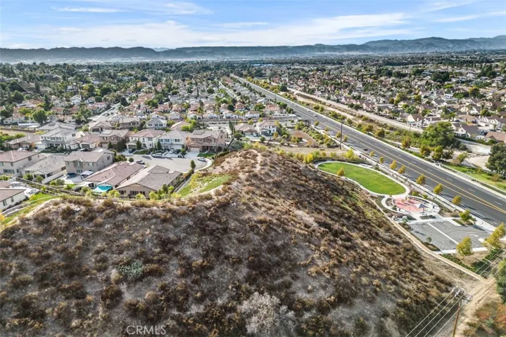 No neighbors on right side or behind.  Just the hill. Park is on right side .