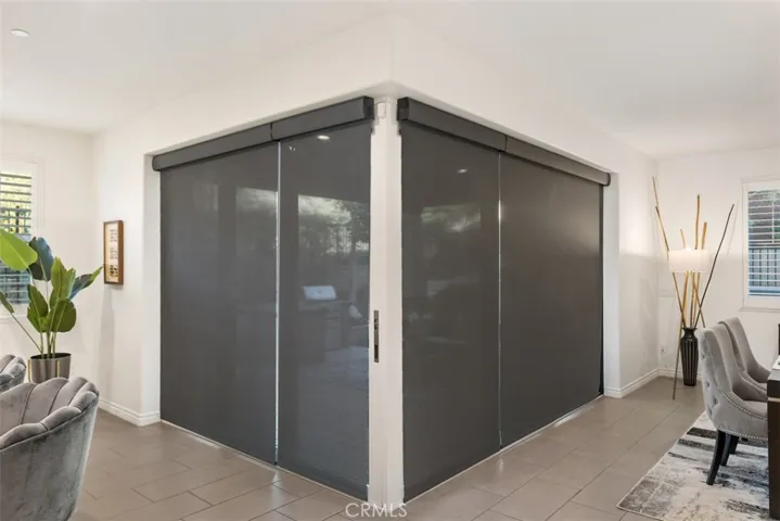 Accordion doors with remote controlled shades down.