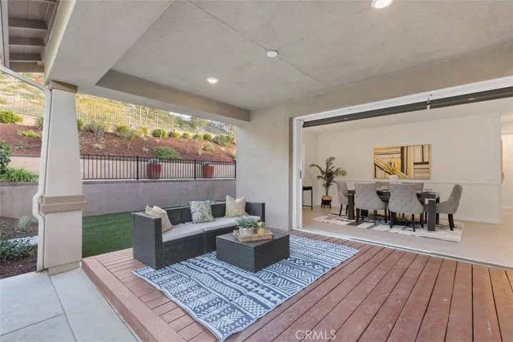 View from Patio area into Dining room with Accordion doors fully opened.