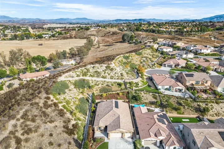 Home is on the left side closest to hill
