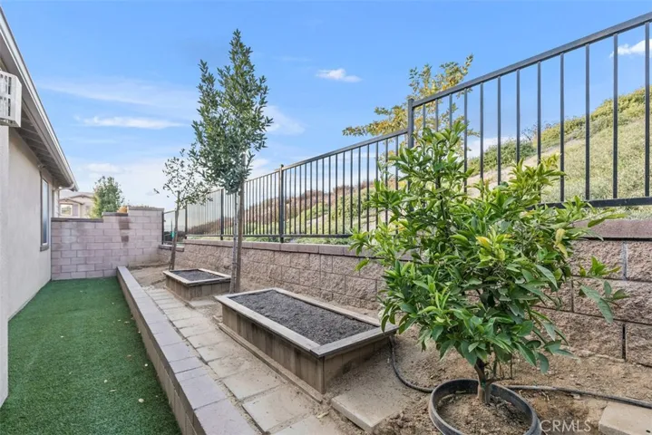 Side yard area  with raised Planter Boxes.