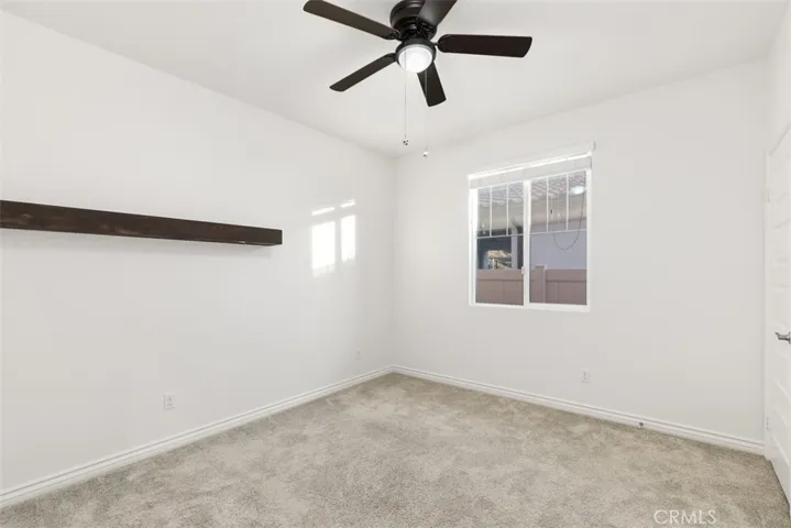 Bedroom #3 with ceiling fan.