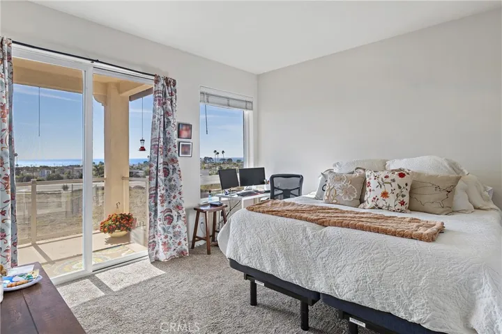 Primary Bedroom looking towards ocean view out sliding glass door