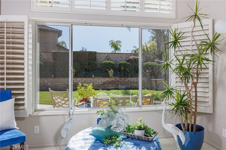 Large picturesque windows to the gorgeous back yard
