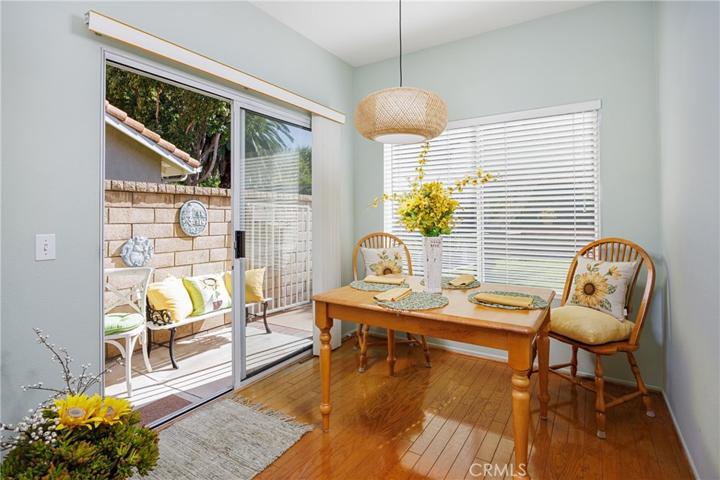 Breakfast nook just off the kitchen offers a glimpse to the tranquil backyard