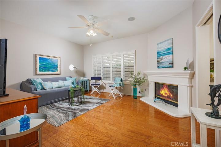 Family room has a gas fireplace with mantle