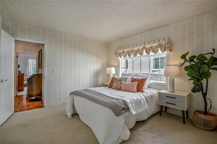 Bedroom #2 is roomy with bay window and mirrored sliding wardrobe
