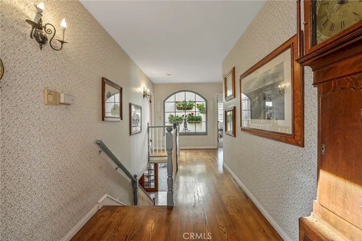 Hallway looks down to an open air atrium with fountain