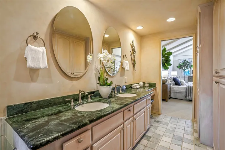 Primary bath has dual sinks and ample cupboard space