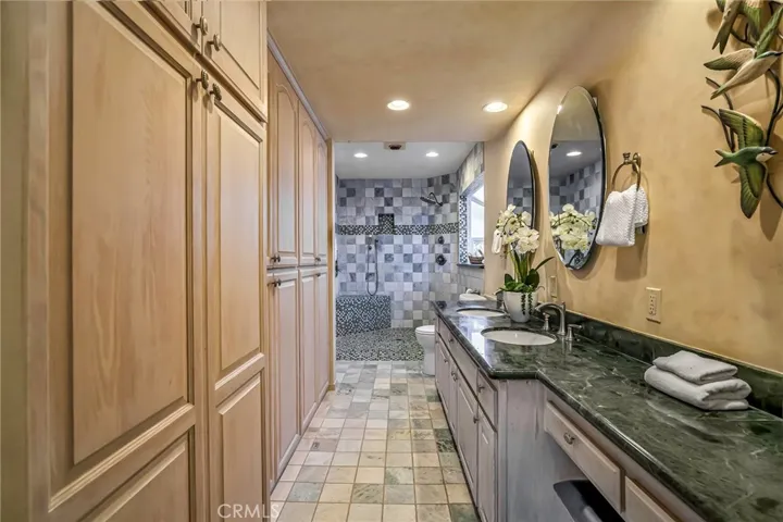 Primary bath is en suite and has a walk in shower
