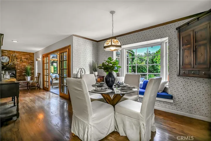 Dining room has a bay window and opens to living room