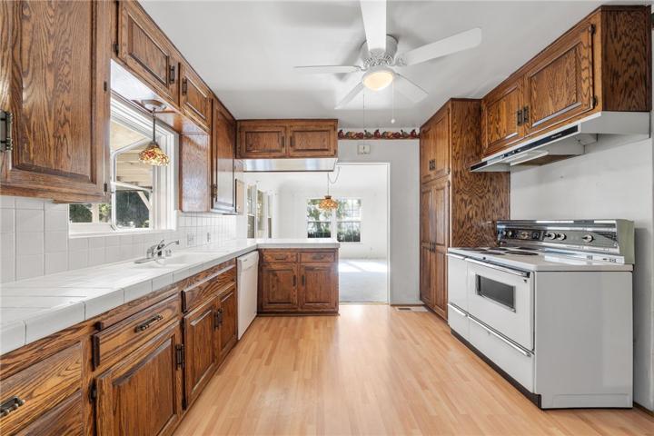 VIEW OF KITCHEN AND ENTRY TO DININGROOM